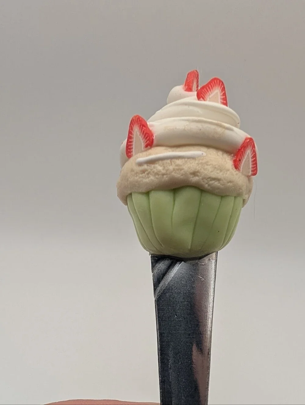 Dessert Spoon With A Strawberry Cupcake On Top